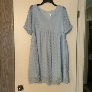 Light blue dress. Size medium super cute just fits too big on me. Light weight.